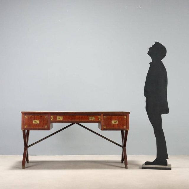 Mahogany writing desk in Naval style, originating from mid-20th century England, represents a perfect blend of...