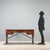 Mahogany writing desk in Naval style, originating from mid-20th century England, represents a perfect blend of...
