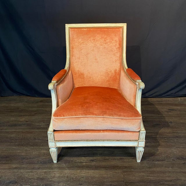 Elegant pair of late 19th / early 20th century French Louis XVI armchairs retaining their original warm salmon mohair...