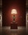 A vintage-style ornate table lamp featuring a warm gold-toned glass body, intricate decorative patterning, antique bronze-...