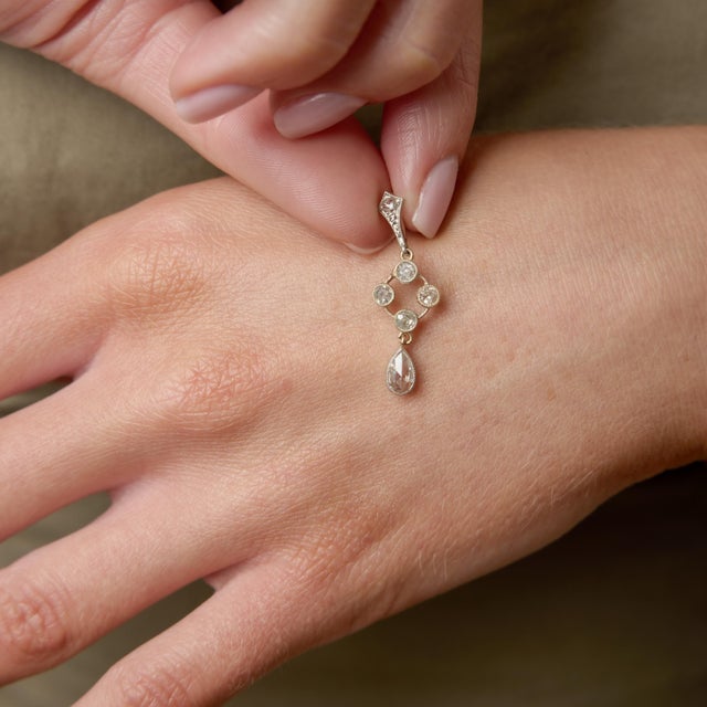 A luminous Victorian treasure from the 1880s, this graceful diamond drop pendant captures the romance and delicacy of...