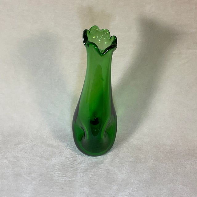 Unique Mid-century handmade clear green glass swung vase with dimples. This piece features dimple indent on both side's...