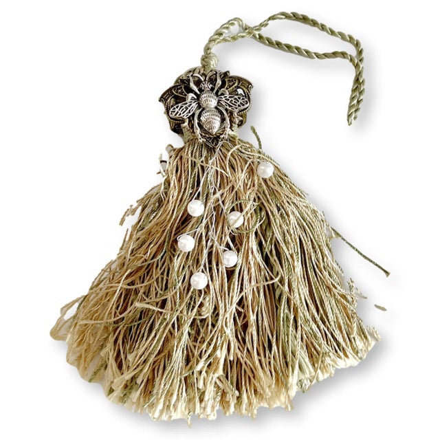 A richly detailed French tassel ornament handcrafted in Paris using a mix of antique and vintage materials. Featuring a...