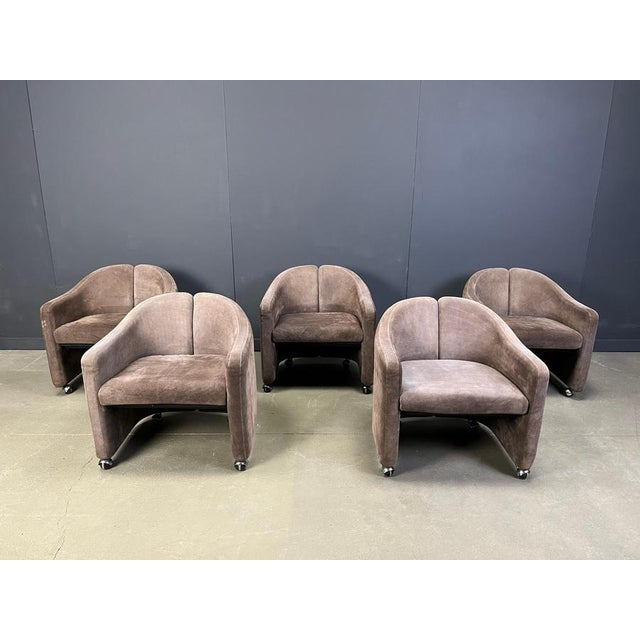 Pair of alcantara PS142 easy chairs designed by Eugenio Gerli for Tecno. Earlier editions with chrome wheels. Good...