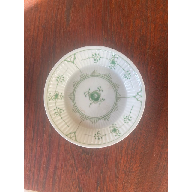 The Royal Copenhagen Green Fluted Plain 2239 is a vintage 4 3/8-inch dish, often historically used as an olive bowl or a...