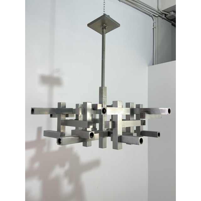 18-light geometric chandelier "Metric" by Gaetano Sciolari, 1970 Metal frame. Exposed E14 bulbs. Metal frame. Fair...