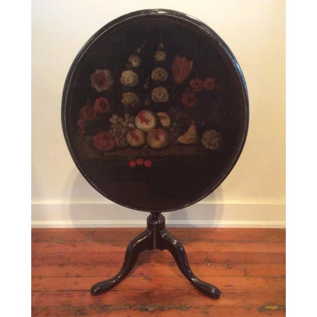 Antique tilt top table with painted top. Beautiful still life painting on oval dish top table. The top is a little wobbly...