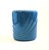 A vintage 1980s ceramic vase. Glossy periwinkle glaze with curved embossed detailing. Measures 7"W x 4.75"D x 8"H