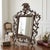 Ornate Rococo Revival tabletop mirror with elaborate scrollwork, acanthus leaf detailing, and a shell crest. Made from...
