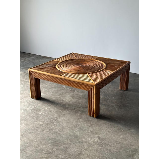 This coffee table is a study in movement — an extraordinary concentric sunburst top of individually applied reedwork...