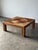 This coffee table is a study in movement — an extraordinary concentric sunburst top of individually applied reedwork...