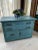 Here we have a small antique blue commode chest. Made of solid oak by the Munk & Roberts Furniture Company in Connersville...