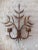 This is a sconce with floral patterns of iron and gilded brass. European Plug (up to 250V).The wiring of this item may be...