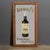 Antique 20th Century rare advertising mirror. This 1930s oak framed advertising mirror shows a bottle of John Dewar & Sons...