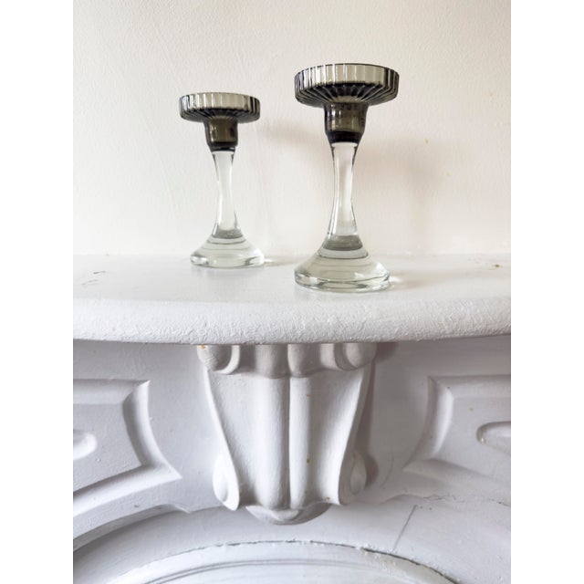 Pair of early 20th century Art Deco glass candlestick holders. Clear pressed glass with flared bell form base and black...