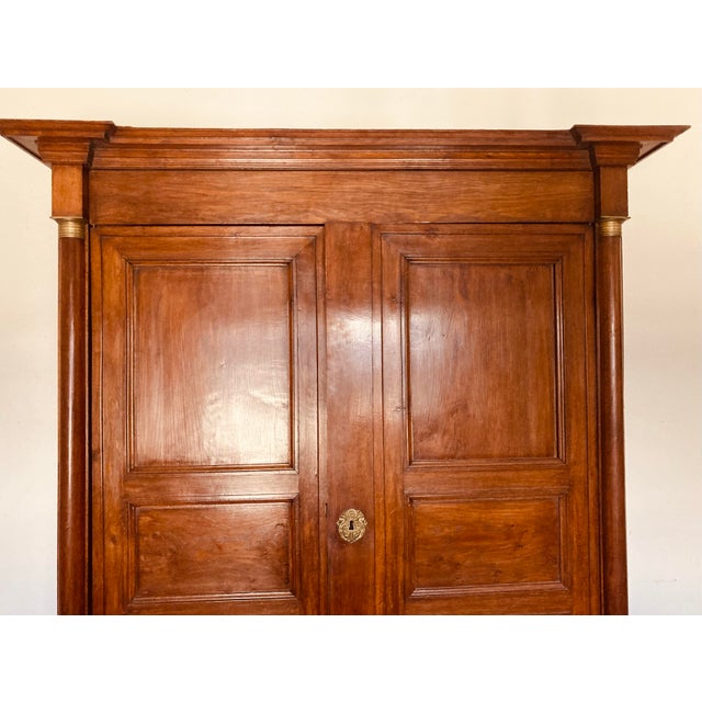 Early 19th Century Antique French Empire Armoire Walnut, Columns to Either Side Front With Bronze Gilt Mounts Also Gilt Bronze Key Hole For Sale - Image 5 of 12