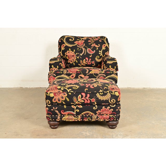 An elegant club chair or lounge chair with ottoman in paisley upholstery By Smith Brothers of Berne USA, Circa Late 20th...