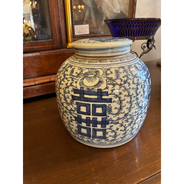 Pair of Vintage Blue and White Bulbous -form Ginger Jars with their original domed porcelain lids, featuring the bold...