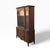 Queen Anne style wood and glass china hutch cabinet with arched glass doors, lower cabinet storage, and shaped carved...