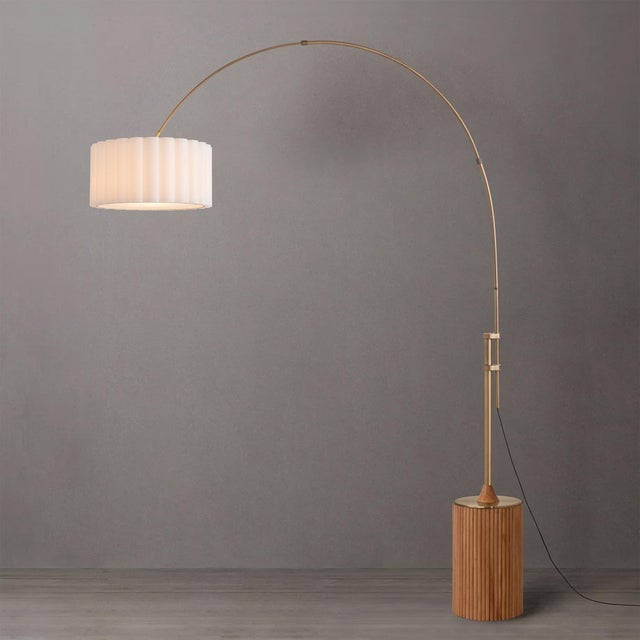 Weathered brass meets hand-crafted natural ash tambour - a smart-home-ready arc lamp with zero installation. The Tambo Arc...