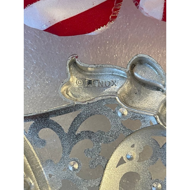 Pair of vintage Lennox silver tone metal Christmas ornaments with peppermint ribbon bows.