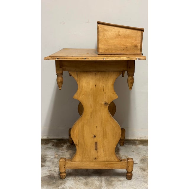 Sourced from the English countryside, this 19th-century English pine table is a remarkable piece with a cleverly designed...