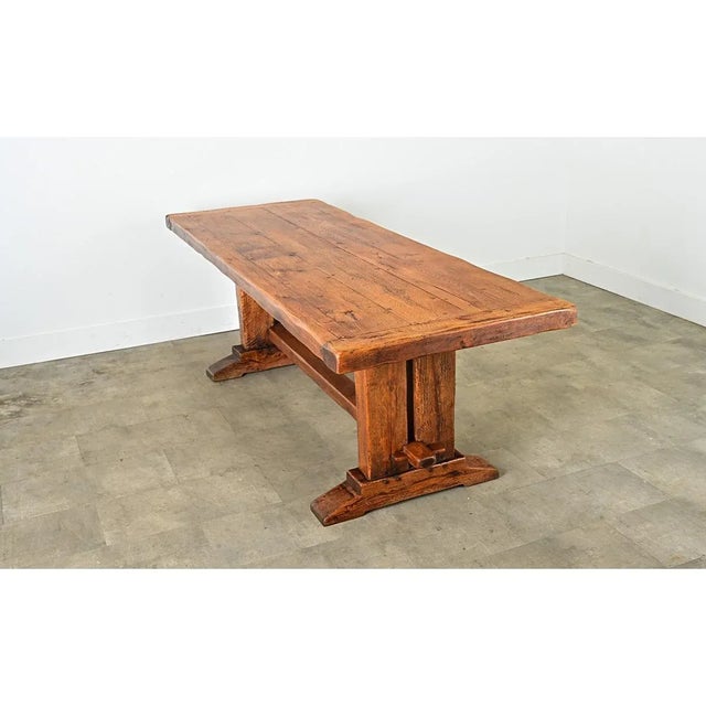 Dimensions: 29 ¼” H x 86 ¾” W x 31 ½” D A monumental 19th century French oak dining table with unique, architectural...