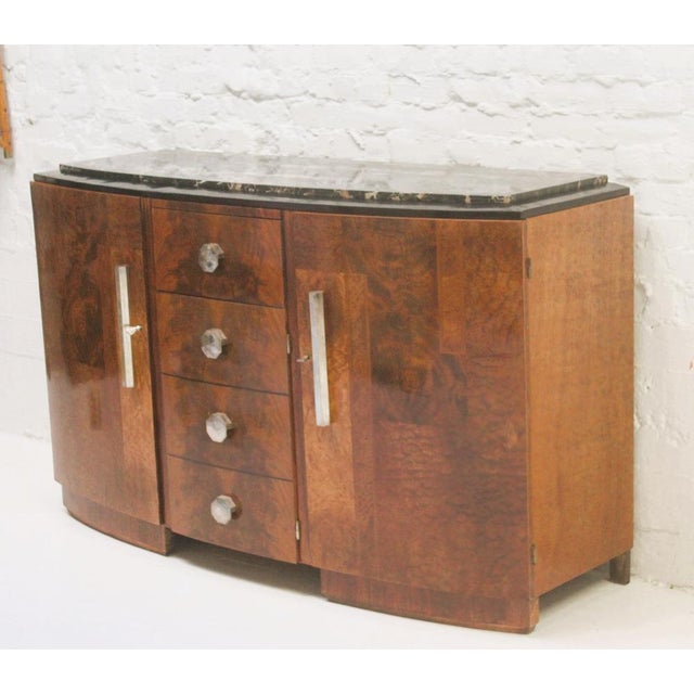 French Art Deco sideboard around 1930s, inlaid with different types of wood in geometric patterns and a trompe l'oeil door...