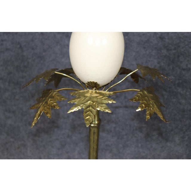 This exceptional pair of decorative candlesticks is a striking example of nature-inspired design, combining elegant brass...