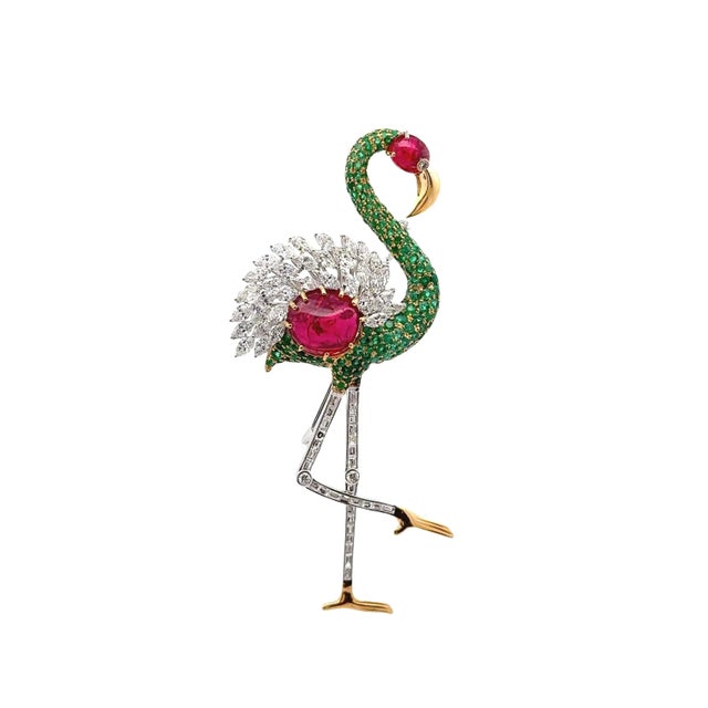 A striking contemporary flamingo brooch embodying modern elegance. The design features two vibrant red cabochon spinels,...