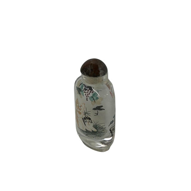 This piece of art features a mesmerizing glass bottle vase adorned with intricate Chinese-inspired oriental scenery. The...