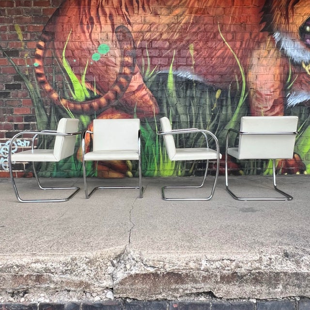 Iconic set of four tubular armchairs designed by Ludwig Mies van der Rohe for Knoll. These timeless modernist chairs...