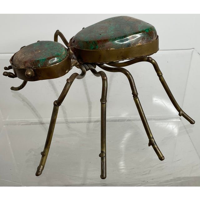 Just in time for Halloween, this whimsical eight legged friend is made of copper and stone. Antennae on the head and legs...