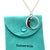 A rare Tiffany & Co. Man in the Moon necklace crafted in sterling silver, featuring a distinctive sculptural moon pendant...