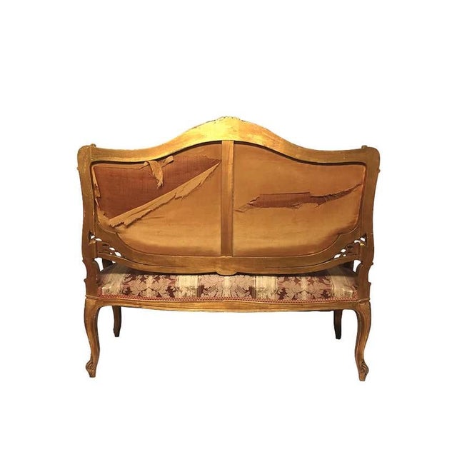 Louis XV style gilt hand carved wood canapé from the 19th century and with silk upholstery of the period. Origin: France....