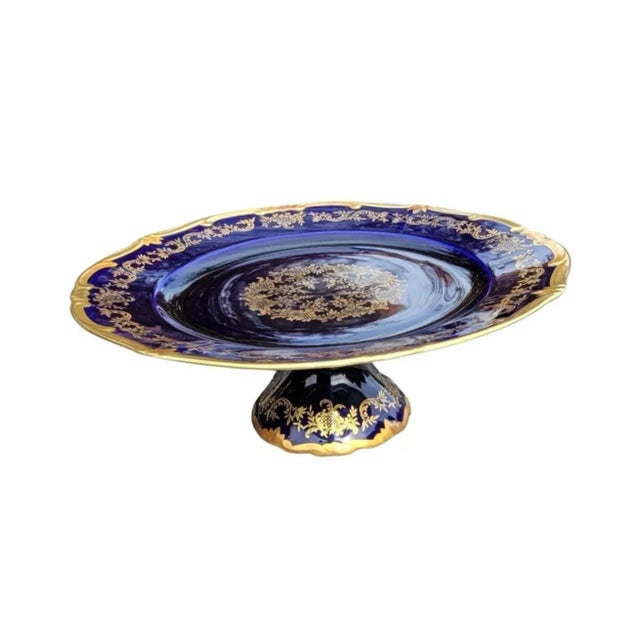 Mid-Century German Cobalt And Gilt Decorated Porcelain Compote. Measures 13" in diameter and 4.5" tall. Great condition