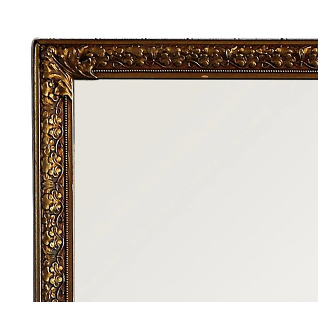 Vintage mirror with gilt gesso on wood frame with Flora and foliate design..