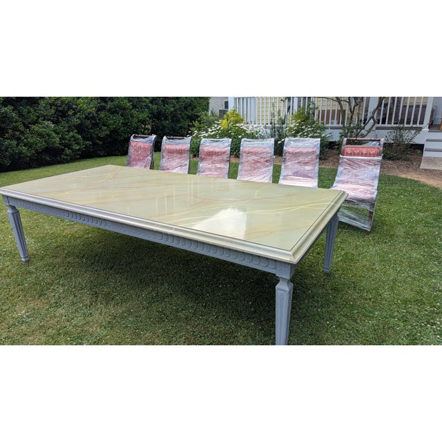 This is a custom made Carleton Varney/Dorothy Draper dining room table that my parents ordered in the 1970s. The chairs...