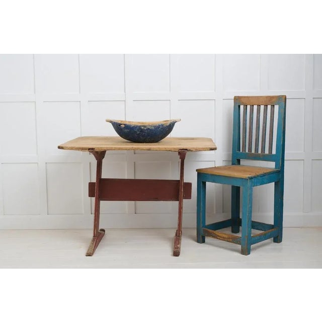 Small folk art table with primitive construction from northern Sweden. The table is made by hand in solid pine during the...