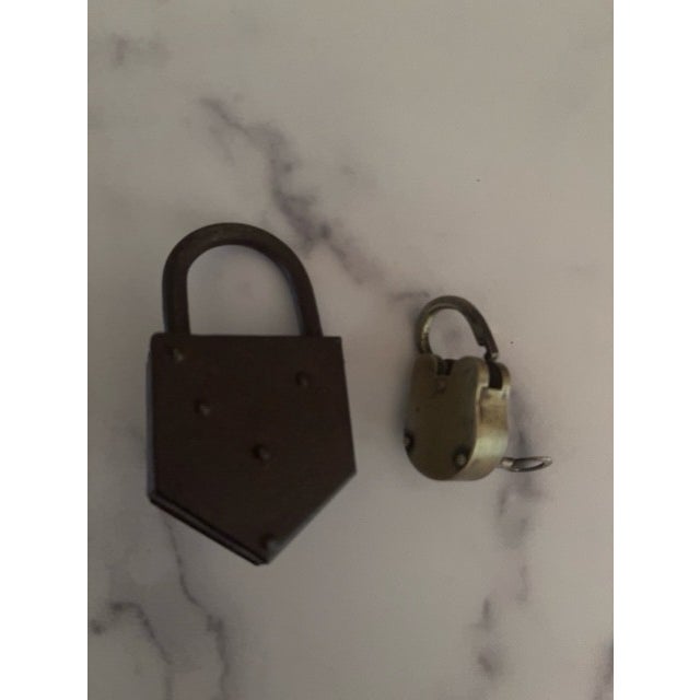 An interesting pair of antique locks. Made of metal and with original keys. Functional, or cool retro decor.