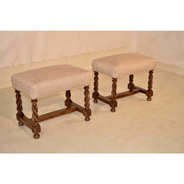 Pair of 19th century walnut stools from France with newly upholstered seats in linen, and finished with a single welt. The...