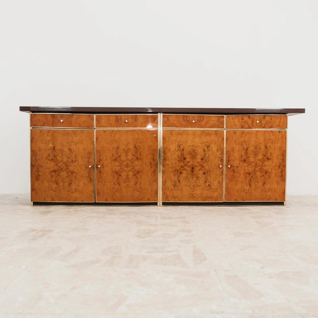 A spectacular and elegant original modern antique sideboard, an excellent expression of 1970s Italian luxury design. This...