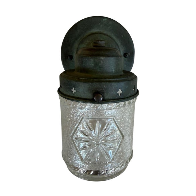 Charming Craftsman-style or Mission-style porch sconce, from the early 20th century. It features a textured, clear glass...