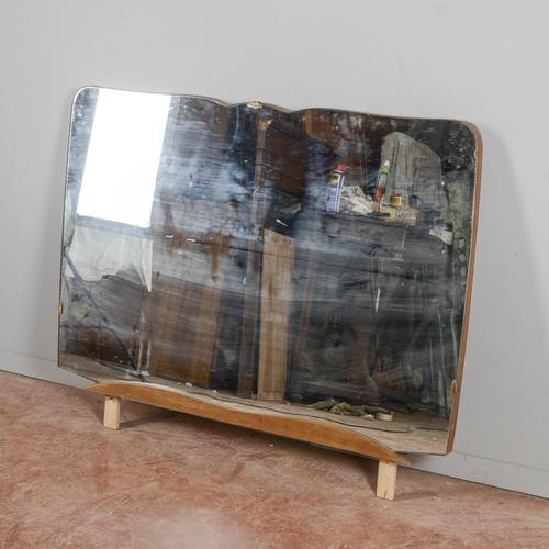 This elegant, contoured mirror with a freestanding base represents a refined example of modern antiques, ideal for those...