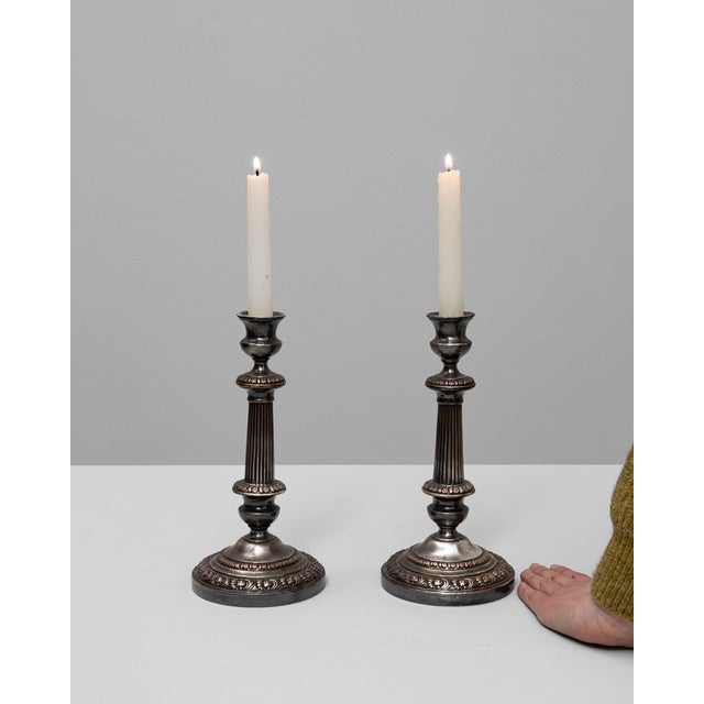 This elegant pair of French candle holders from the 19th century exemplifies refined Neoclassical design. Each piece...