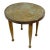Vintage Moroccan style footstool with brass clad top embossed with geometric designs. No maker's marks.