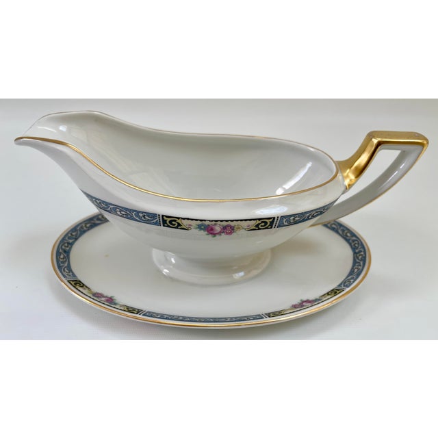 Large gracefully decorated Art Deco-style Bavarian porcelain gravy boat beautifully banded in blue with splashes of floral...