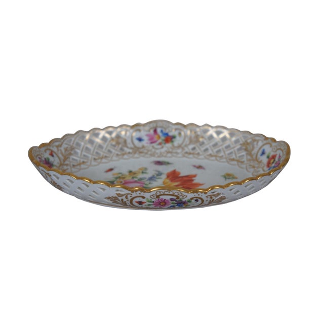 Early 20th century Meissen porcelain dish. Oval form with pierced basket weave sides, scalloped edge, hand painted with...