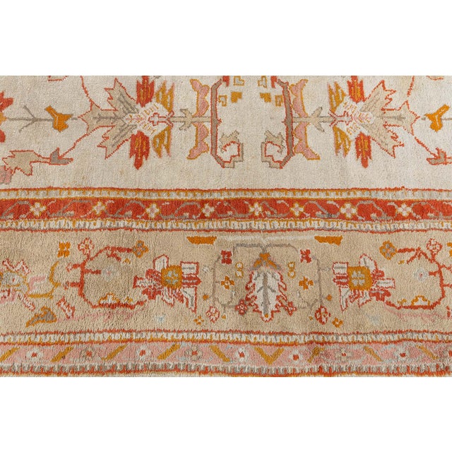 This exquisite early 20th-century Turkish Oushak rug, dating from circa 1900, exemplifies the timeless artistry and...
