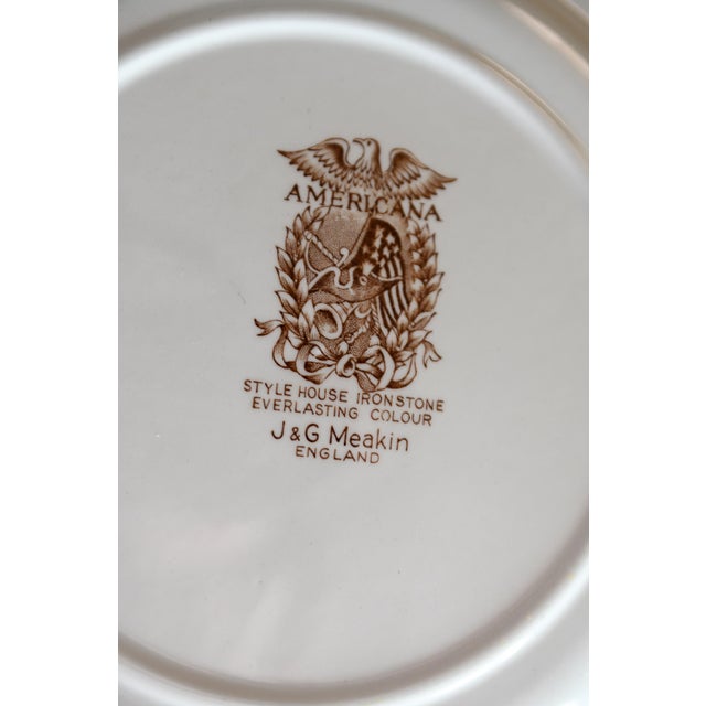 This ironstone brown and white transferware plate depicts a classic American scene of Mt. Vernon, home of George...